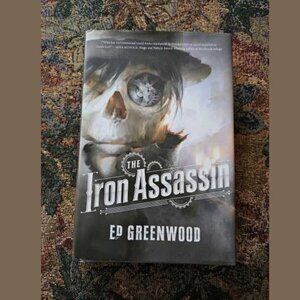 The Iron Assassin, a steampunk thriller novel, hardback book, by Ed Greenwood